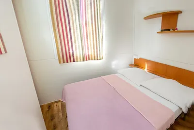 Camping Imperial - Schlafzimmer eines Mobilheims