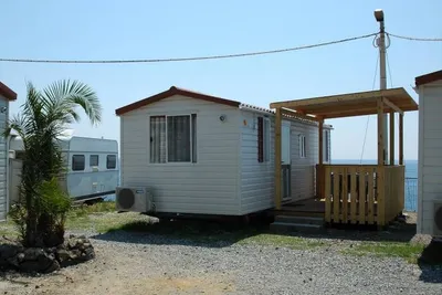 Camping Jonio  -  Mobilheim vom Campingplatz mit Veranda und Blick auf das Meer